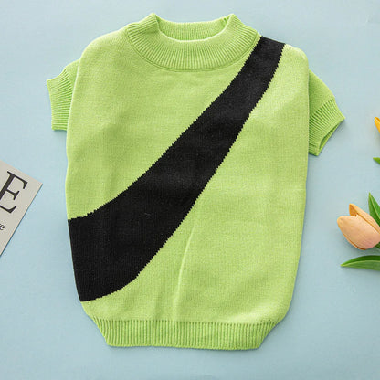 Corgi wearing a soft wool dog sweater in light green, showing casual style and fit.