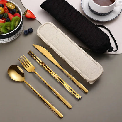 Gold and black stainless steel knife fork spoon set inside a grey mesh carrying bag.