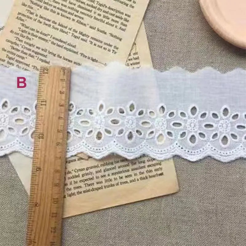 Cotton embroidered lace trim ribbon showing floral cutout patterns in four different width styles