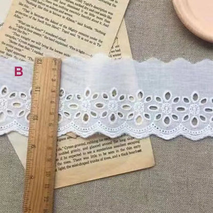Cotton embroidered lace trim ribbon showing floral cutout patterns in four different width styles