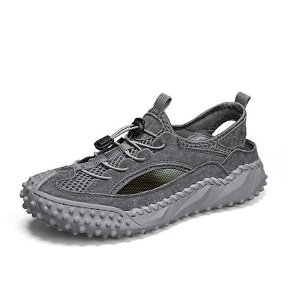 Men's black waterproof wading sandals with elastic band and perforated leather mesh upper on a rubber sole.