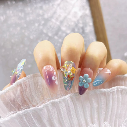 Handmade nail art sculpture set with embossed flower and butterfly designs in four sizes for almond-shaped nails