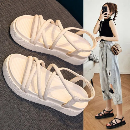 Women's black Roman platform sandals with straps on a white background.