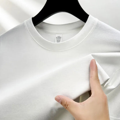 Men's thin cotton drop shoulder t-shirt on a hanger, shown in a light colour.