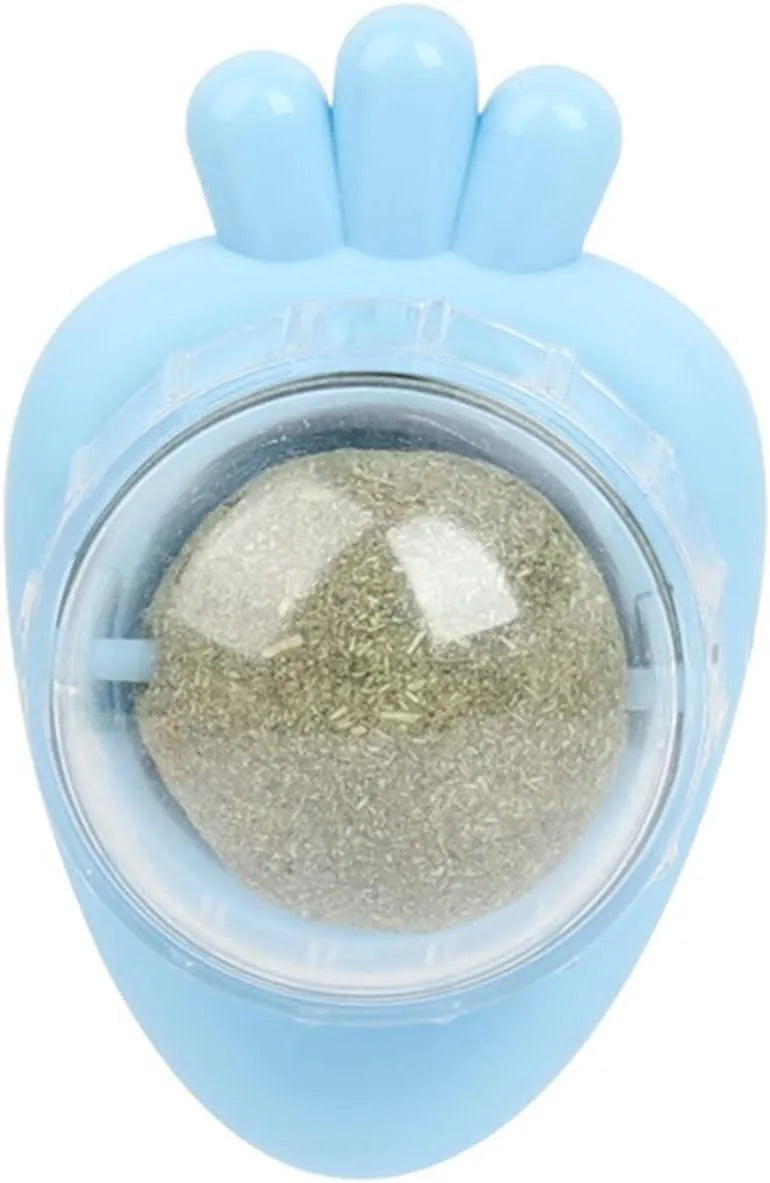 Four blue carrot-shaped catnip balls with adhesive backs and clear covers on a white wall