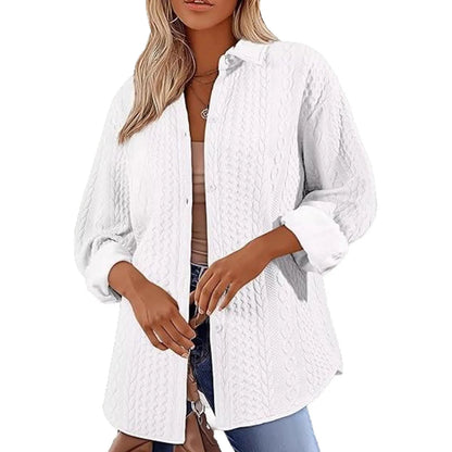 Women's solid colour long-sleeved cardigan sweater in black, shown in a commute-style setting.