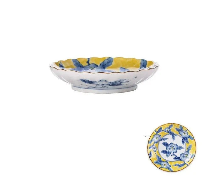 Yellow ceramic tableware set with colourful floral patterns, includes bowls and plates in Japanese style