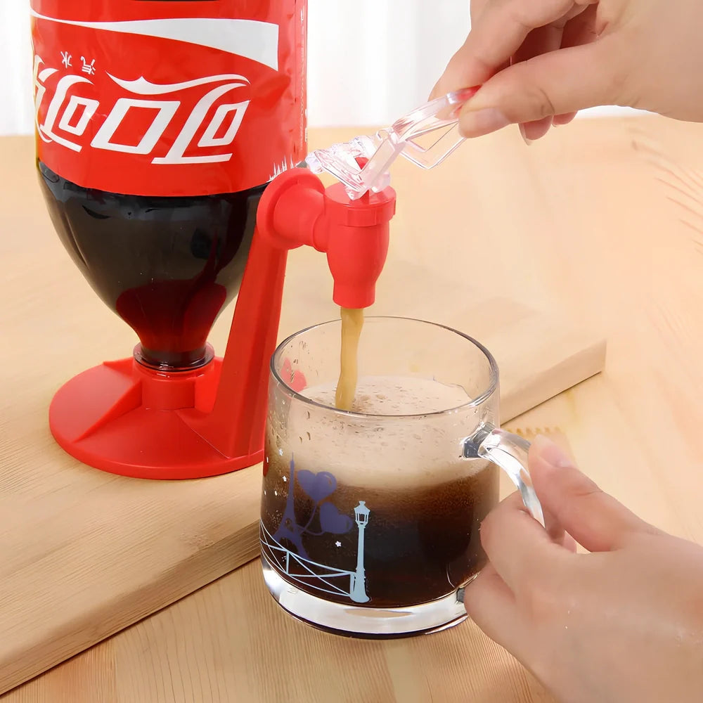 Red automatic soda dispenser gadget attached to beverage bottle for hands-free pouring