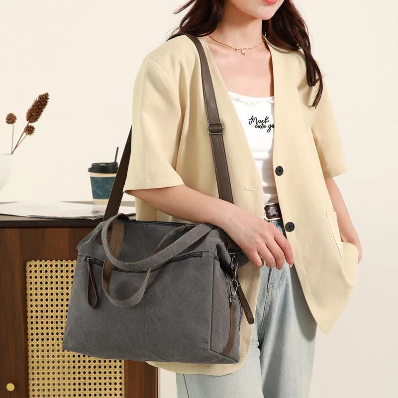 Large capacity retro canvas bag for women with soft horizontal square design, featuring multiple internal compartments including zipper pocket, mobile phone pocket, and document pocket, finished in a selection of neutral colours for daily use.