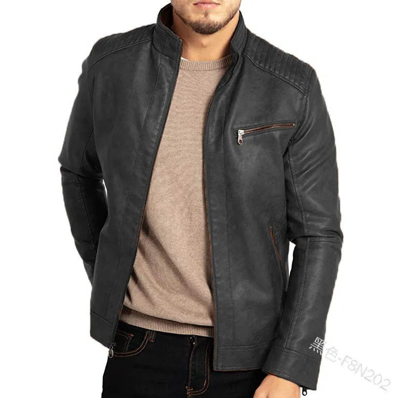 Men's brown artificial leather punk motorcycle jacket with a stand collar and straight hem on a grey background.