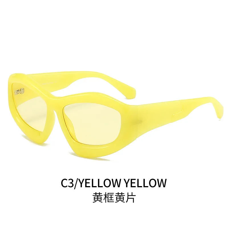 Outdoor unisex sunglasses with concave bubble lenses in black frame on a table.