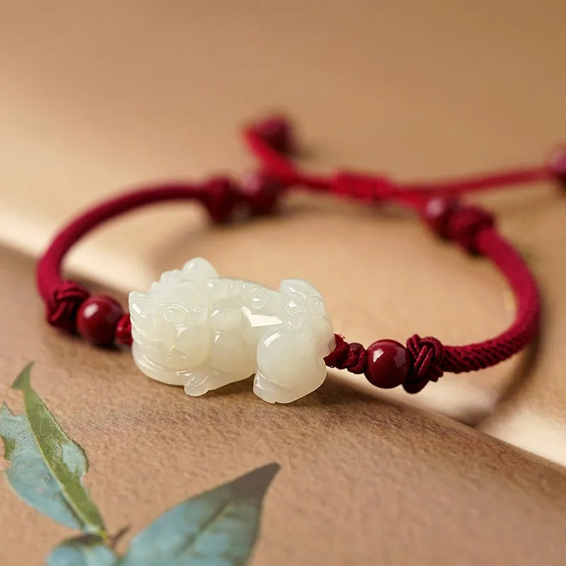 Hetian jade bracelet with black and red adjustable ropes in traditional Chinese design