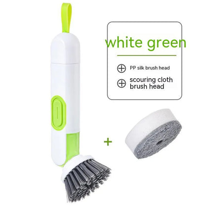 White and red long-handle kitchen brush with soap dispenser button and two interchangeable scrub heads on a hook.