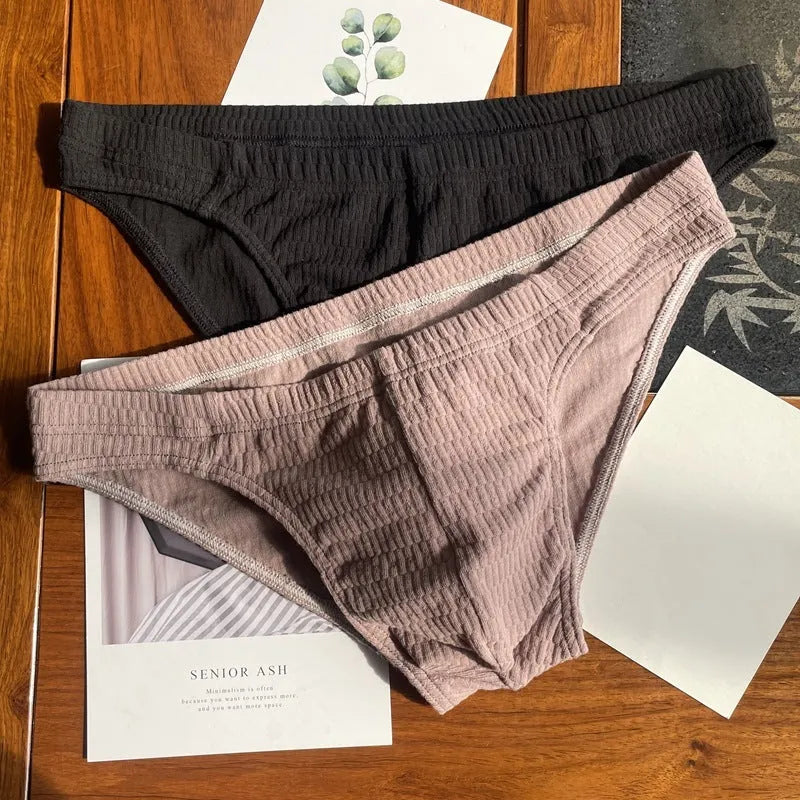 Men's solid colour pure cotton triangle underwear briefs on a mid-waist fit model