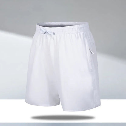 Man wearing black loose-fit quick-dry polyester sports shorts on a summer day.