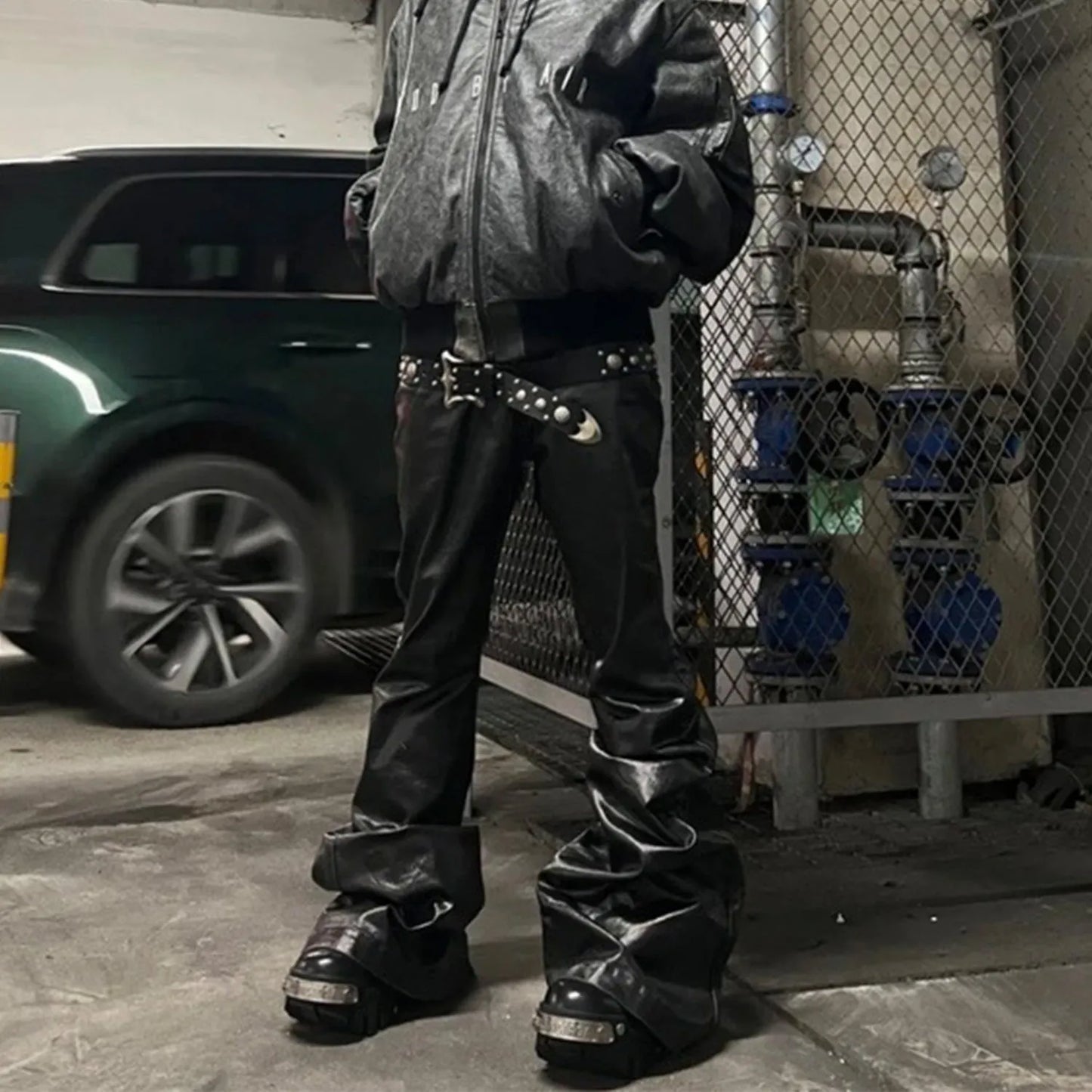 Black shiny patent leather coated skinny jeans with straight leg and mid waist