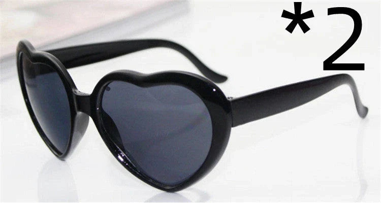 Fashionable heart-shaped light-up glasses with a built-in LED lighting system, perfect for adding a touch of love and playfulness to any occasion.