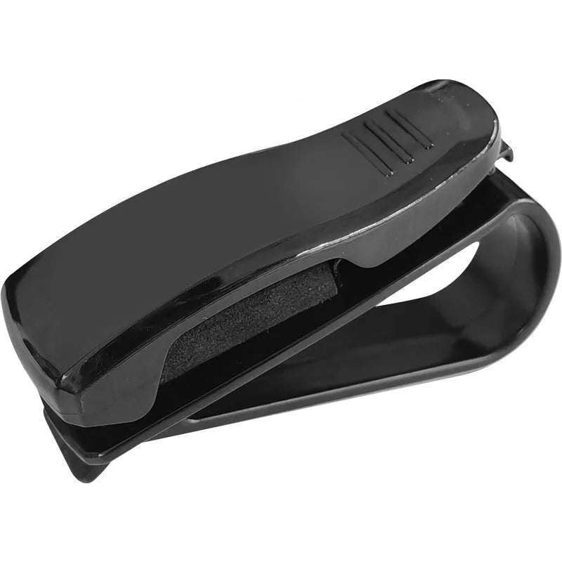 Black plastic clip for car sunshades to hold tickets, ID cards, or glasses.
