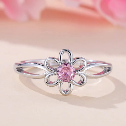 Women's flower hollow ring in pink diamond colour with floral design on copper band