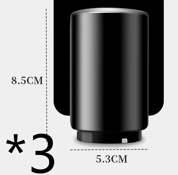 Stainless steel automatic bottle opener measuring 8.4 cm by 5.3 cm on a kitchen counter