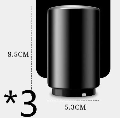 Stainless steel automatic bottle opener measuring 8.4 cm by 5.3 cm on a kitchen counter