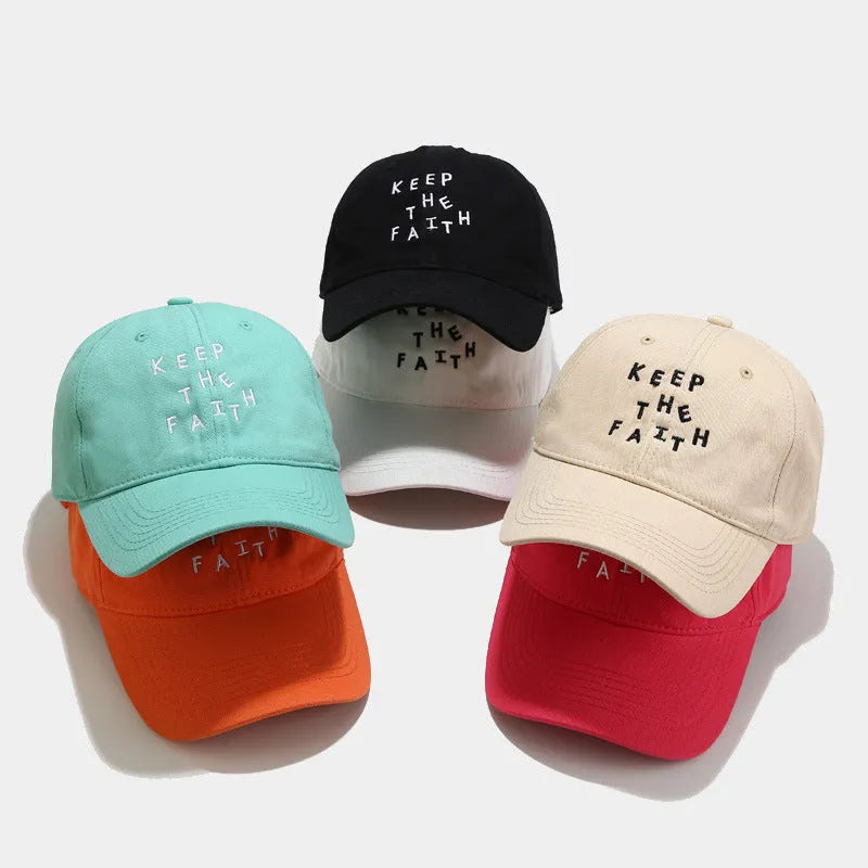 Men's cotton baseball cap with small embroidered letters on front in adjustable dome design