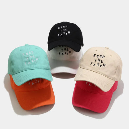 Men's cotton baseball cap with small embroidered letters on front in adjustable dome design