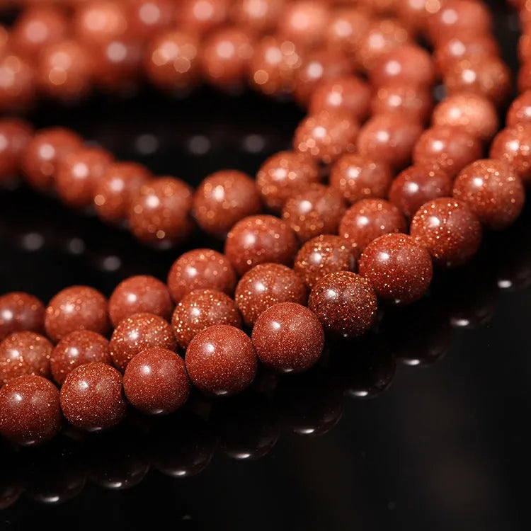 Women's golden star stone colour bracelet with 108 nugget sand pieces showing mantra text and fu character design