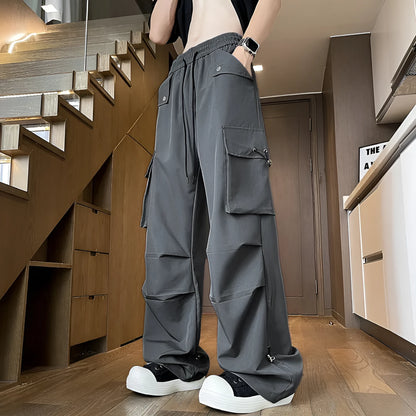 Plus size thin waterproof trousers in a loose straight-leg style on a hanger.