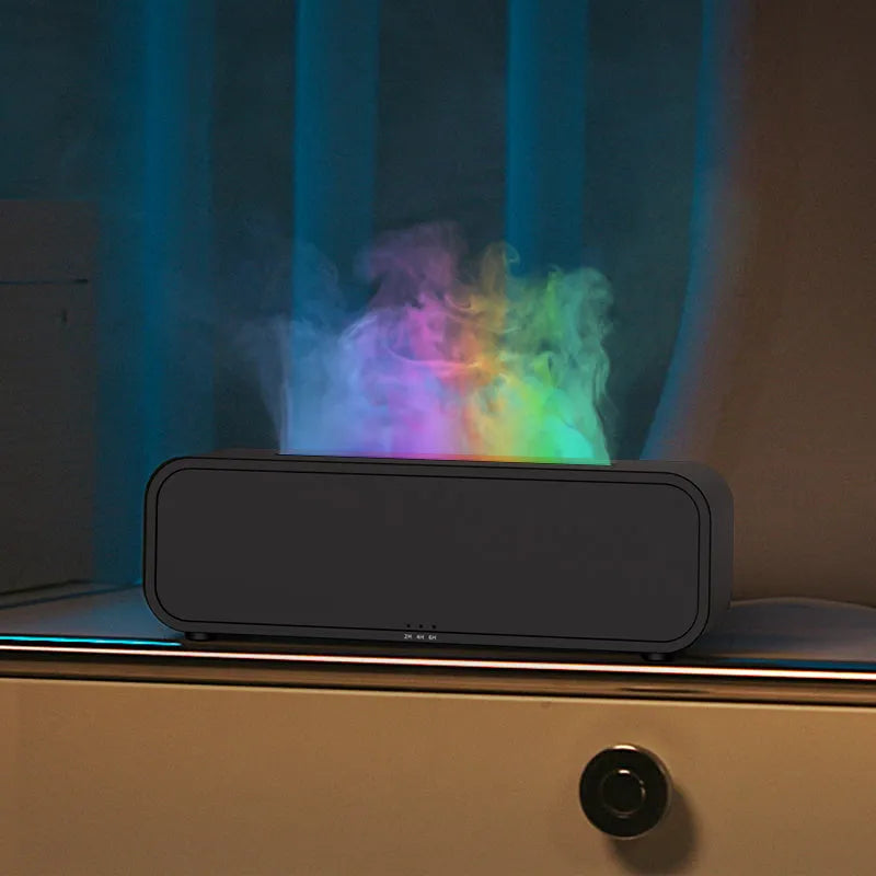Black and white USB aroma diffuser with remote control showing flame dynamic and colour-changing light effects.
