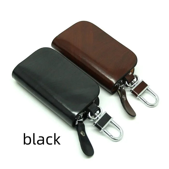 Genuine leather car key case with zipper closure showing black and brown colour options