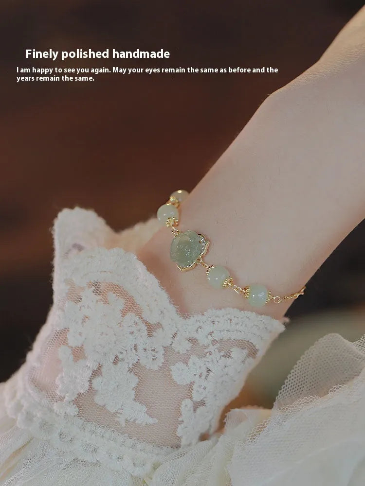Women's bracelet with Hetian jade rose flower design and 14K gold gilding