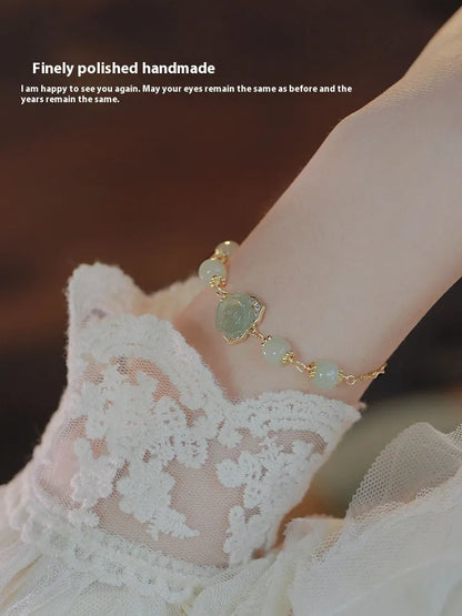Women's bracelet with Hetian jade rose flower design and 14K gold gilding