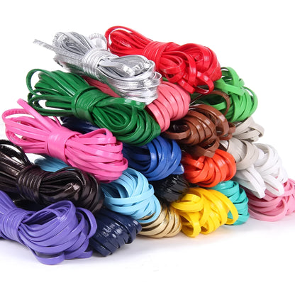 Coiled reels of PU leather craft string in multiple colours including beige, black, red, and blue.
