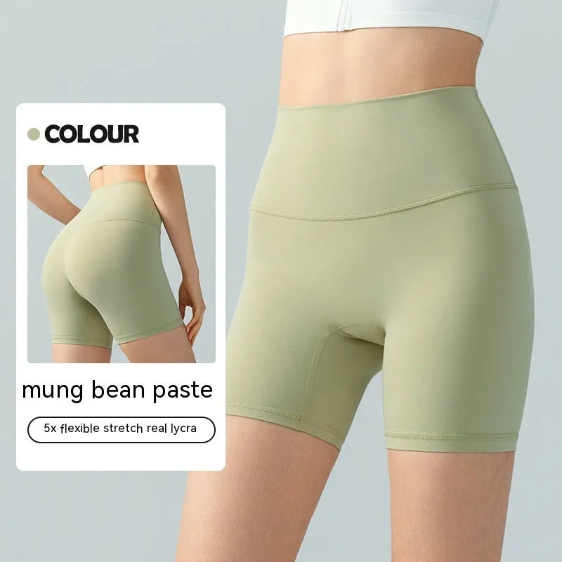 Women's high-waist Lycra yoga shorts in leaf green for yoga and fitness