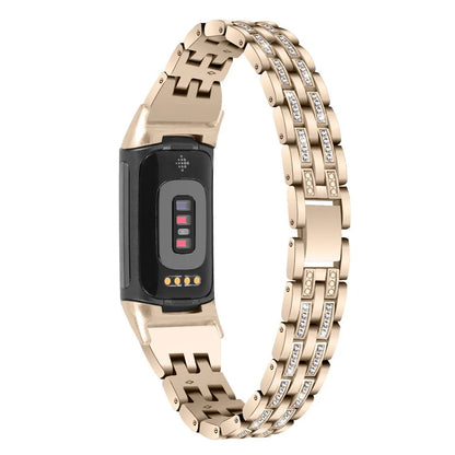 Diamond-patterned metal watch strap for Fitbit Charge 5 in rose gold colour.