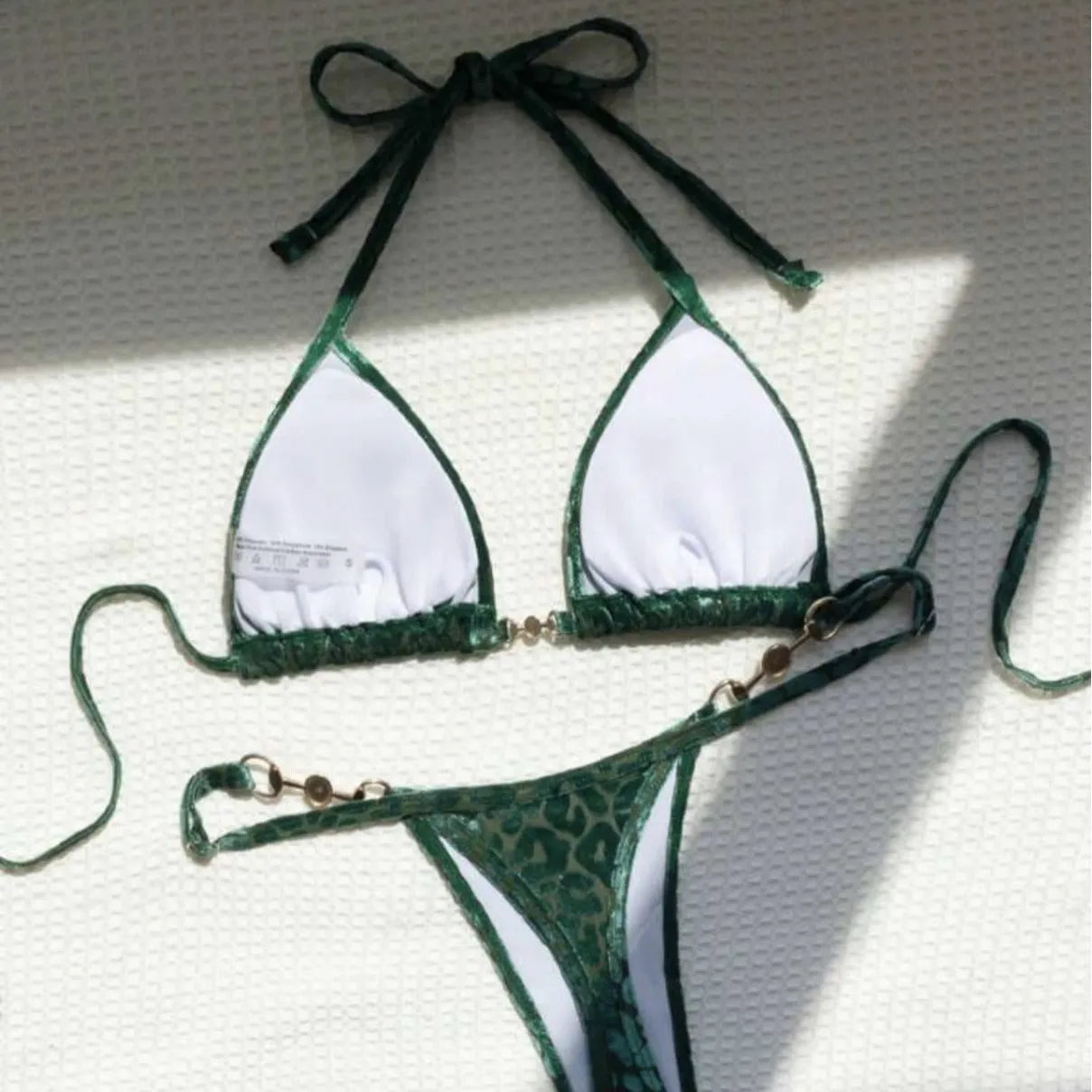Women's leopard print bikini swimsuit set in various colours including blue and green, shown in triangle and skirt styles.