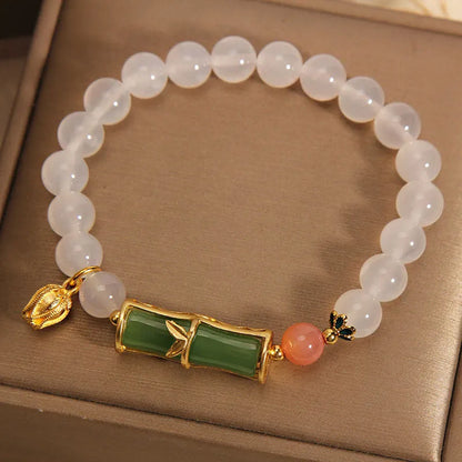 Women's white agate and jade bamboo bead bracelet in retro Chinese style.