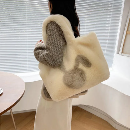 Soft plush tote bag with cartoon rabbit ears in solid colours like beige, pink, and black.