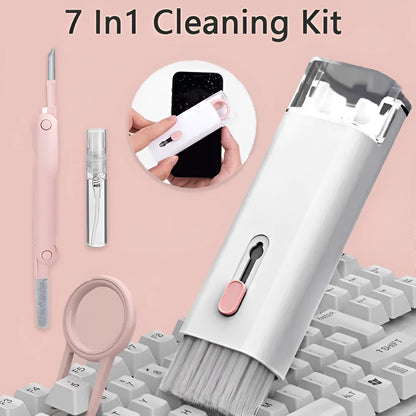 White electronics cleaning kit with a cleaning pen, spray bottle, brush, and keycap puller on a table