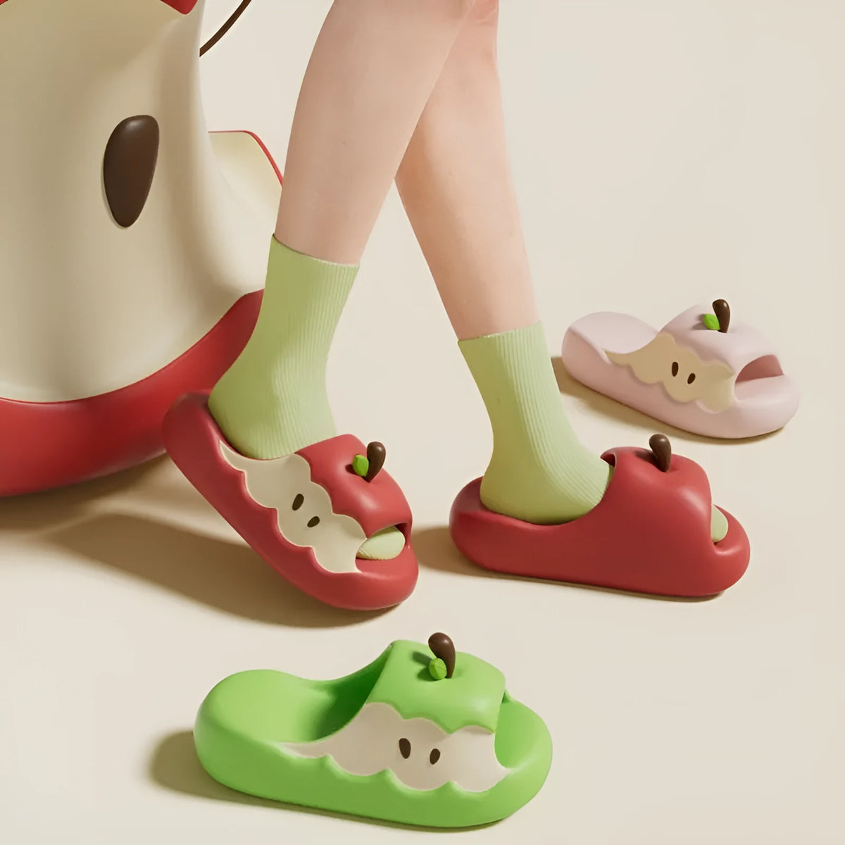 Cartoon fruit-themed EVA flip flop slippers for adults on a plain background.
