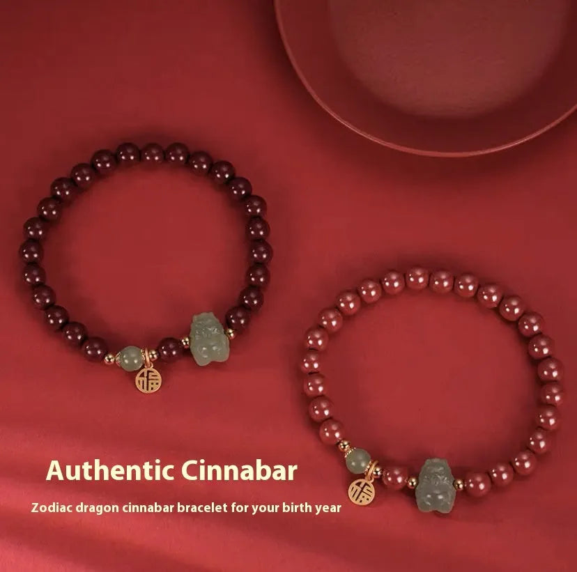 Natural Hetian jade bracelet with zodiac carvings and cinnabar accents in 8mm diameter