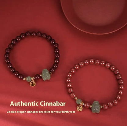 Natural Hetian jade bracelet with zodiac carvings and cinnabar accents in 8mm diameter