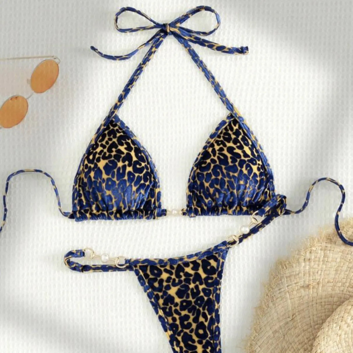 Women's leopard print bikini swimsuit set in various colours including blue and green, shown in triangle and skirt styles.