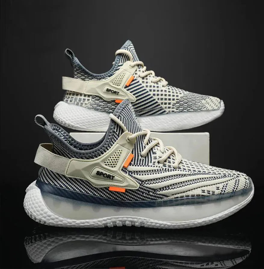 Men's white low-top sneakers with mesh upper and flat rubber sole on a grey background.