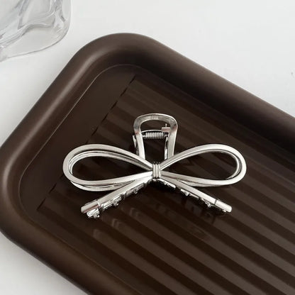 Silver metal hair claw barrette example from a range of 44 Korean-style designs.