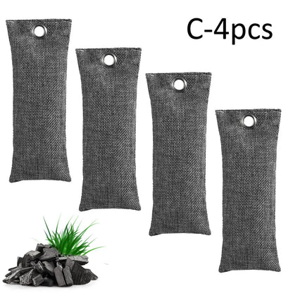 Set of black, green, grey, and blue rectangular bamboo charcoal deodorising bags on a white surface.