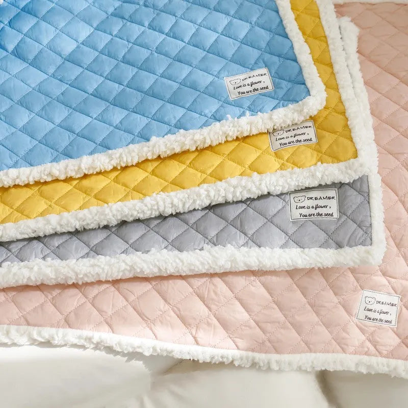Blue quilted terry cloth pet blanket for cats shown in a cage, with size options M, L, and XL available.