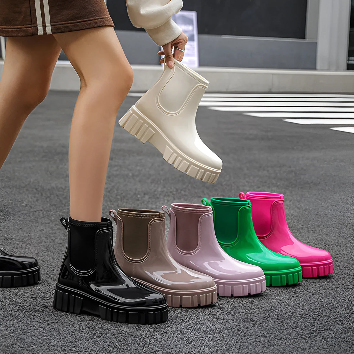 Women's creamy-white low tube PVC rain boots with a flat heel and thickening sole, shown from the side.
