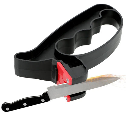 Black handheld knife and scissor sharpener with ergonomic grip, showing tungsten steel grindstone slot.